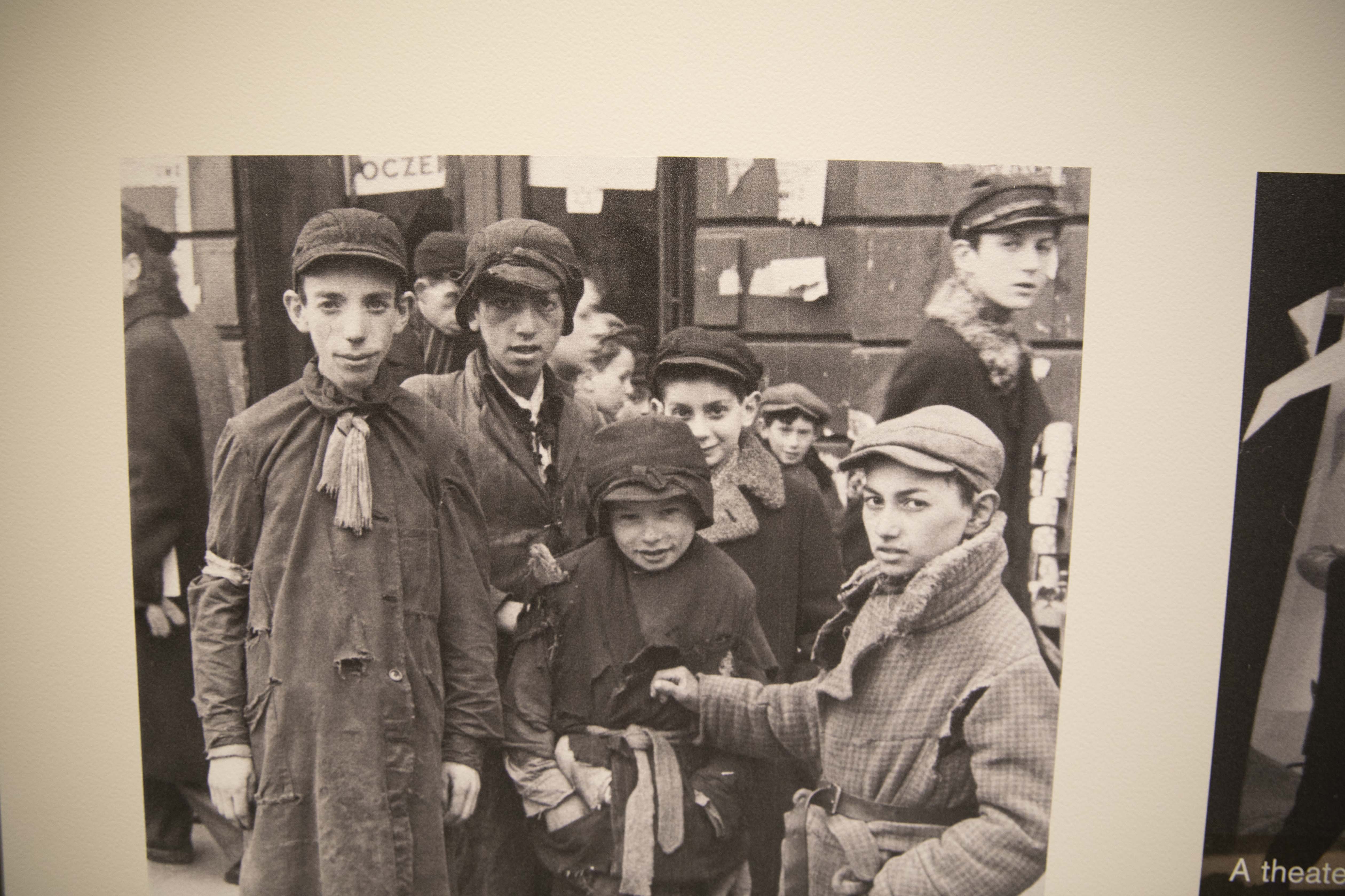 Holocaust survivor Max Glauben (fourth center from left with his face covered) stands with other boys in Warsaw, Poland before his family is deported to the Majdanek concentration camp in Poland. (Photo via Dallas Holocaust and Human Rights Museum)