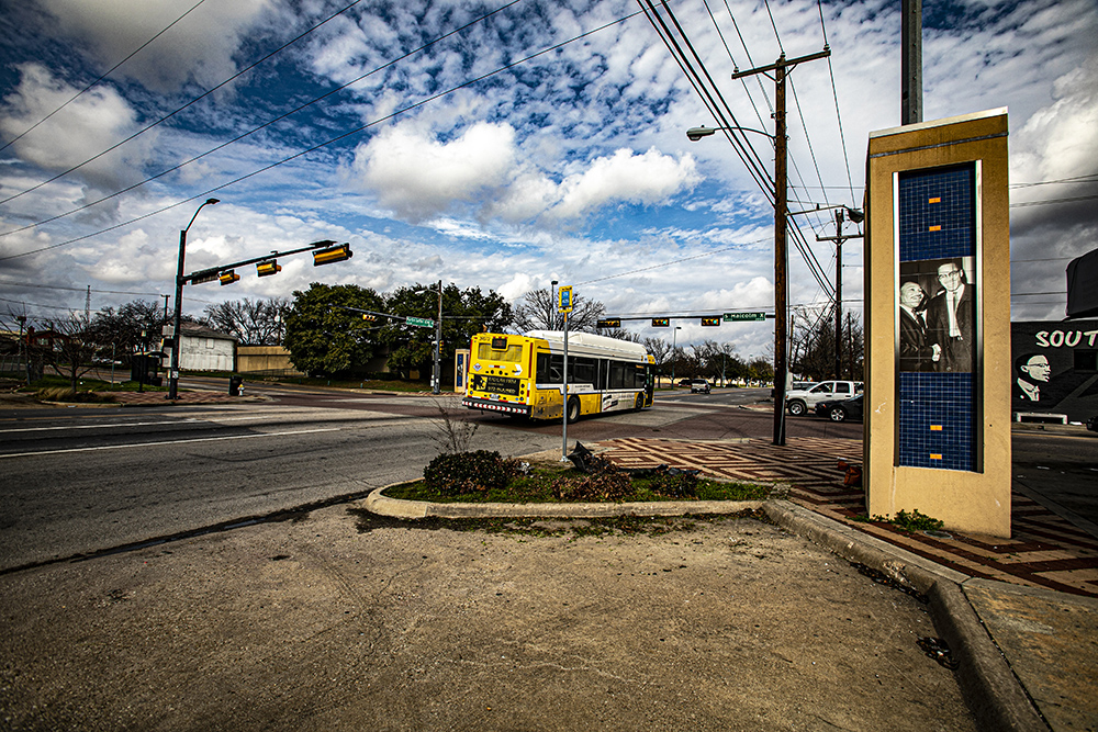 A DART bus passes near the Malcolm X Boulevard Transfer Location in Dallas.